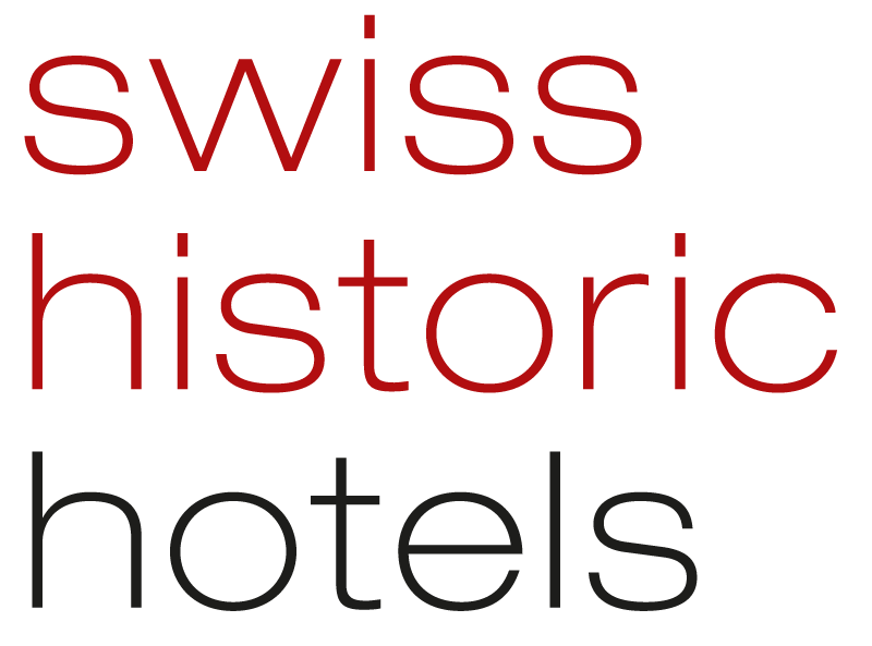 Das Bild zeigt die Worte swiss historic hotels in einer modernen, serifenlosen Schrift. Swiss und historic sind in rot, während hotels in schwarz ist, alles auf einem weißen Hintergrund.